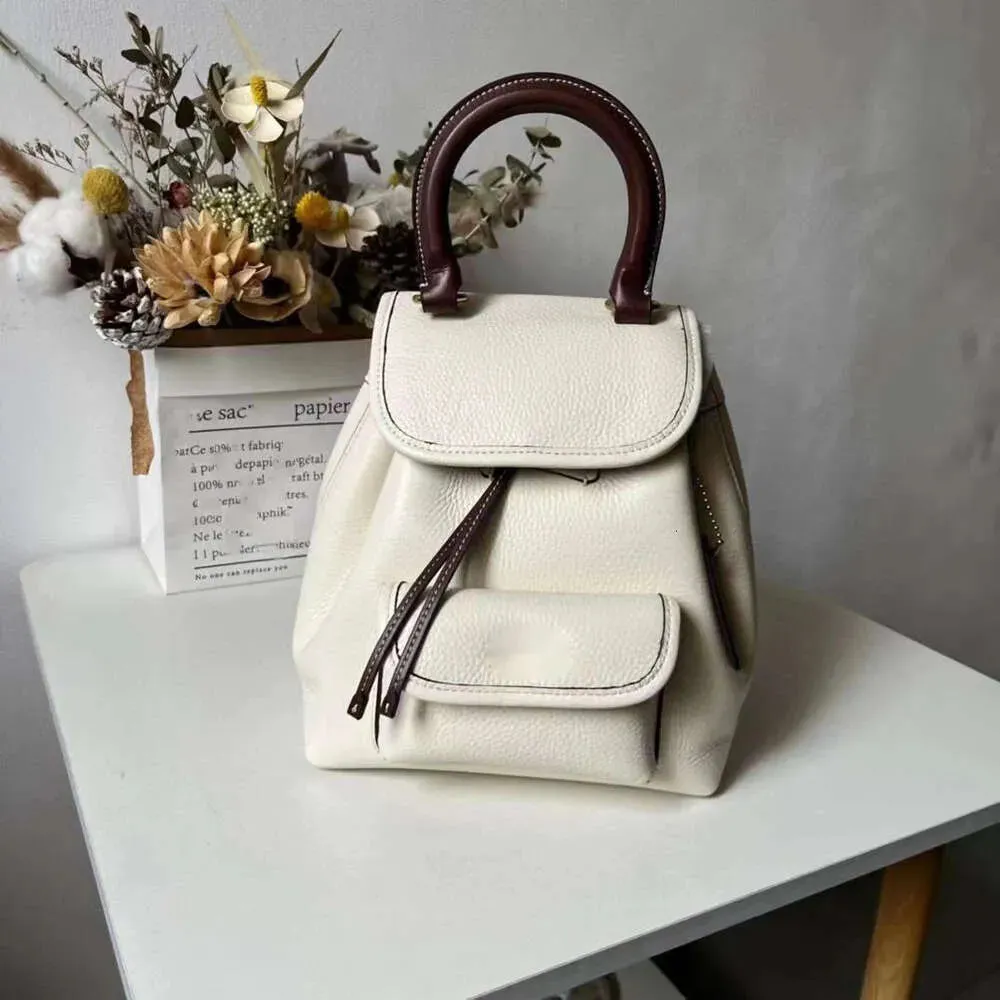 Riya 13 Stay Cord Hasp Opening Closing Backpack Style Designer New Coaches Mini Womens Backpack Versatile Backpack Trend Light Book Bag Macaron Womens Bag