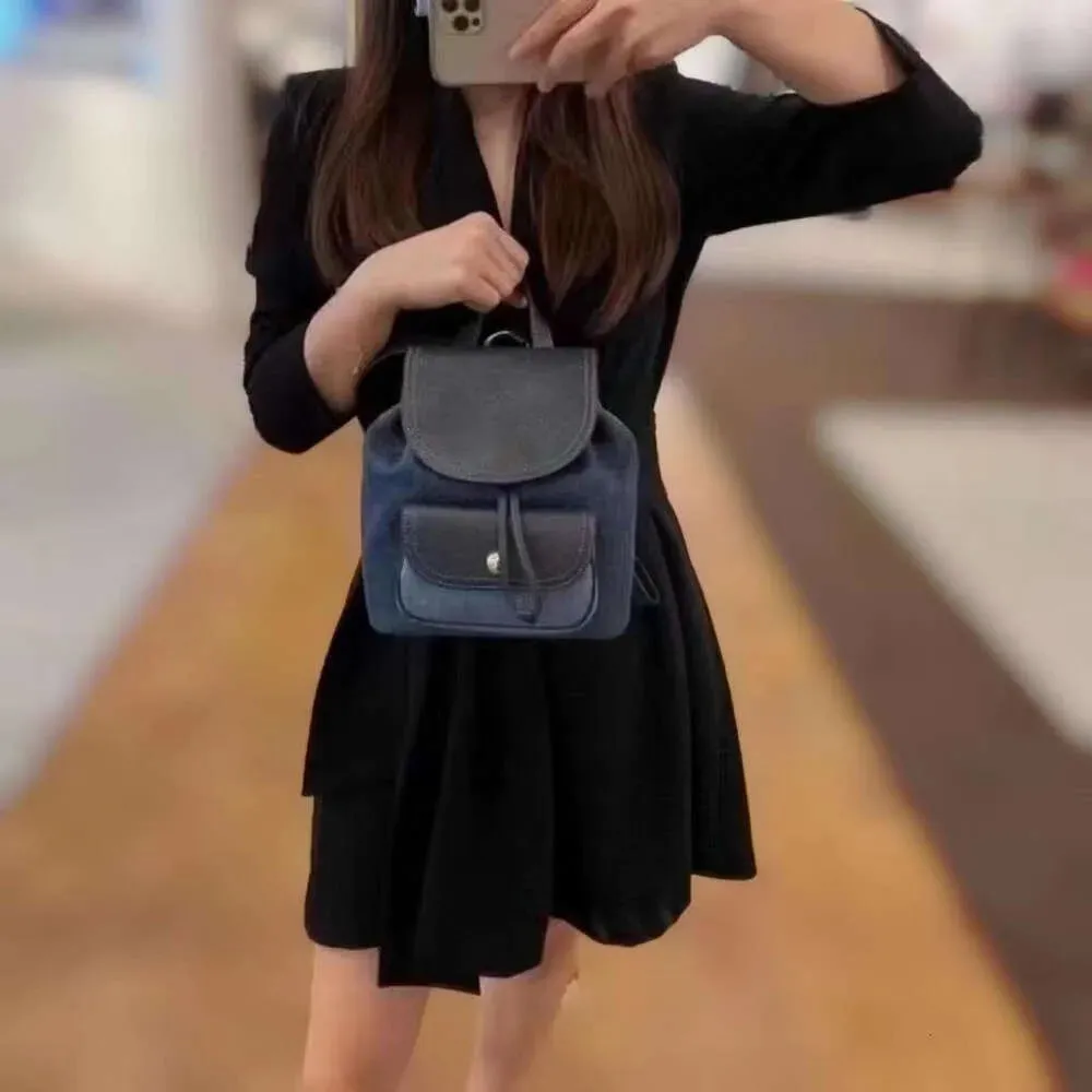 Riya 13 Stay Cord Hasp Opening Closing Backpack Style Designer New Coaches Mini Womens Backpack Versatile Backpack Trend Light Book Bag Macaron Womens Bag
